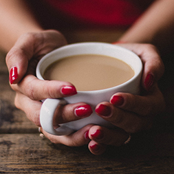 Hands holding a coffee mug